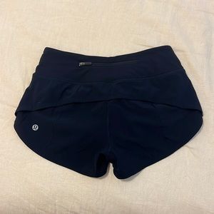 Speed Up Low-Rise Lined Short 2.5”. Color Navy blue